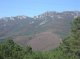 Vale Torto catchment occupies the central lower part of this image. The catchment is c. 10 ha in size and is being instrumented to record soil losses before and after prescribed (controlled) fire. Prescribed fire is a measure intended to reduce the fuel load and therefore the likelihood of wildfire and its degradational effects. (© Rick Shakesby)<br>