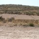 Ephemeral gully development on a bare field caused by runoff water from upslope shrubland (© Joris de Vente 2007)